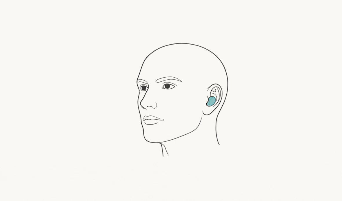 A head with an in-ear wearable in place